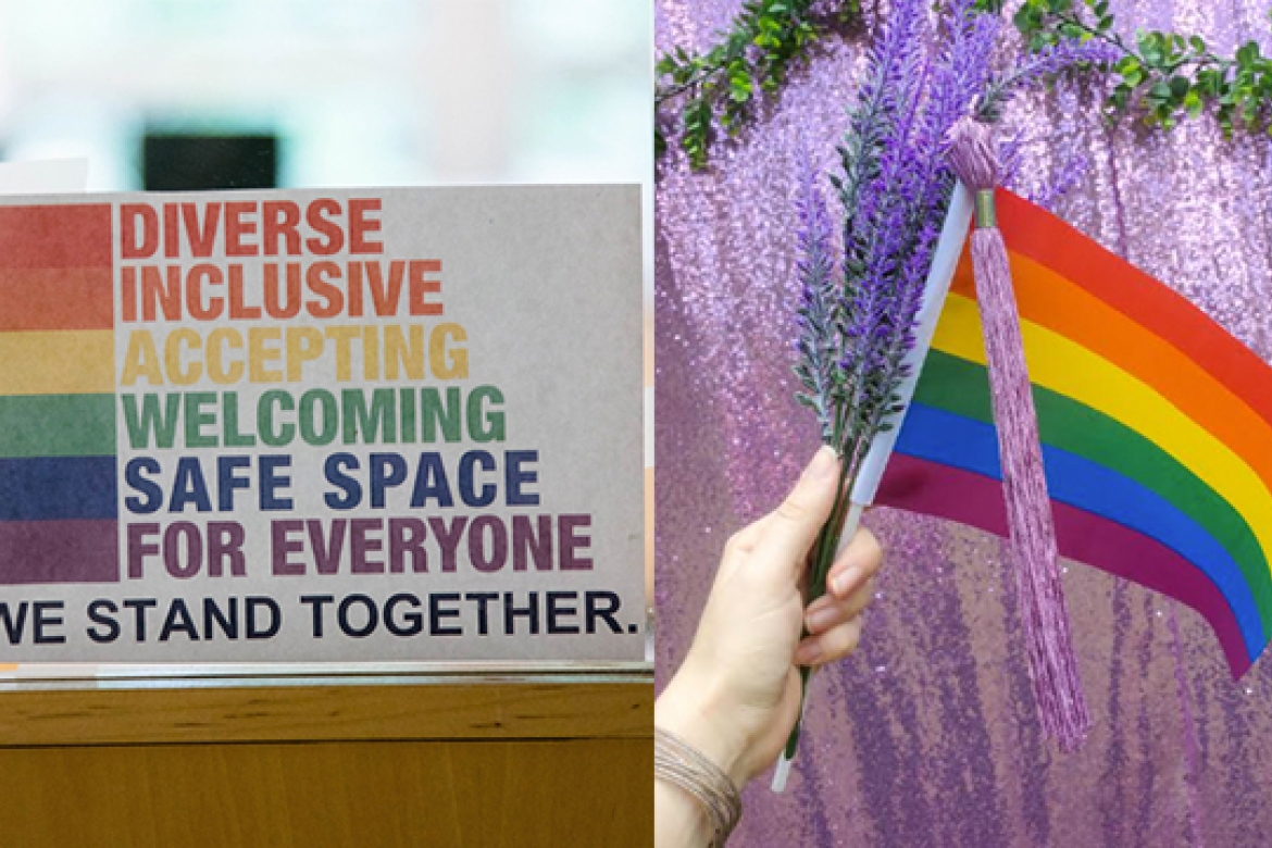 A sign that reads "Diverse, Inclusive, Accepting, Welcoming, Safe Space for Everyone" next to a hand holding a rainbow flag