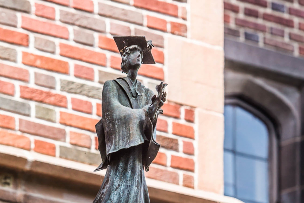 Statue on Mount Holyoke campus of a female scholar