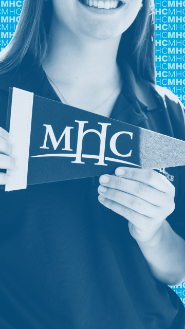 Vertical graphic featuring a close-up of a student holding an MHC pennant