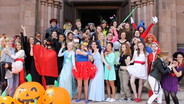 A group of students in costumes outside Abbey Chapel