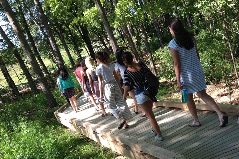 campus-living-lab-boardwalk.png Students walking on the living lab boardwalk