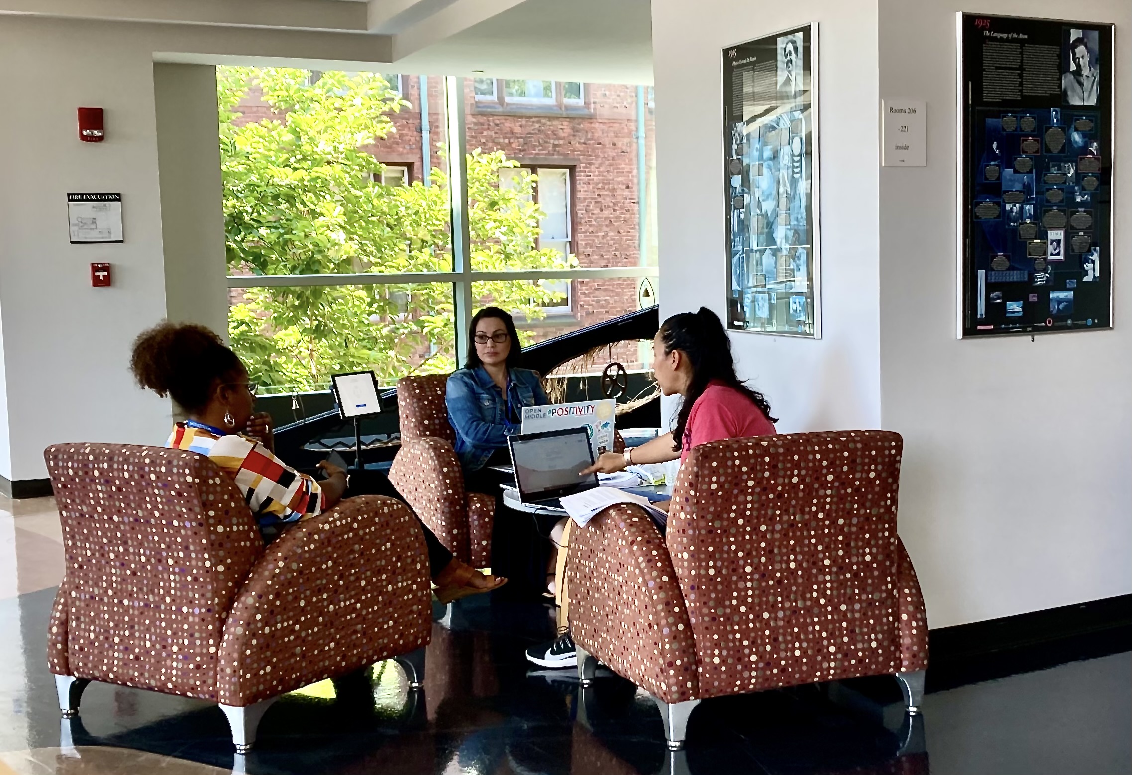Professional and Graduate students in a discussion group with the instructor.