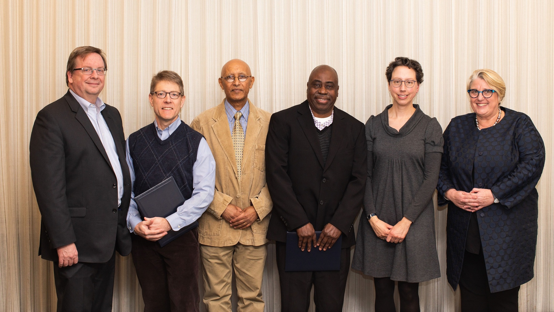 Dean of Faculty Jon Western with professors Jeremy King, Girma Kebbede, Bode Omojola and Amy Frary, and President Sonya Stephens 
