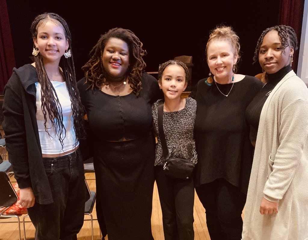 Marcella Runnell poses with attendees at TOCLC.