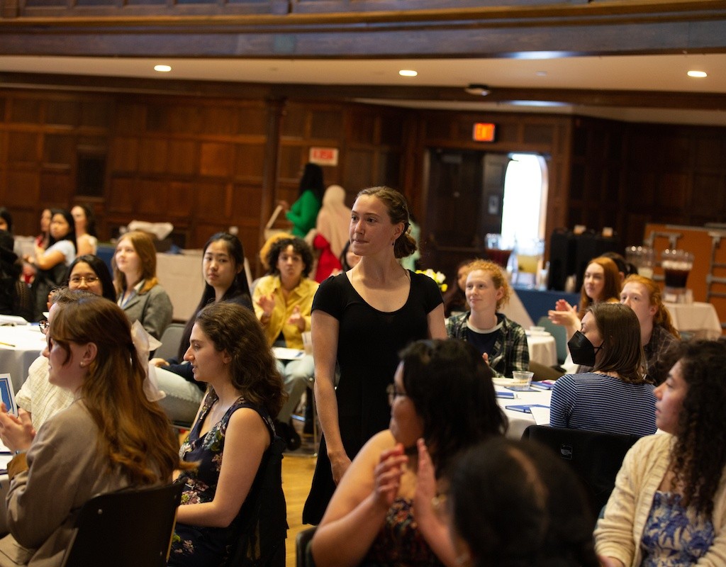 Student stands in the crowd at the annual Leadership and Service Awards Ceremony