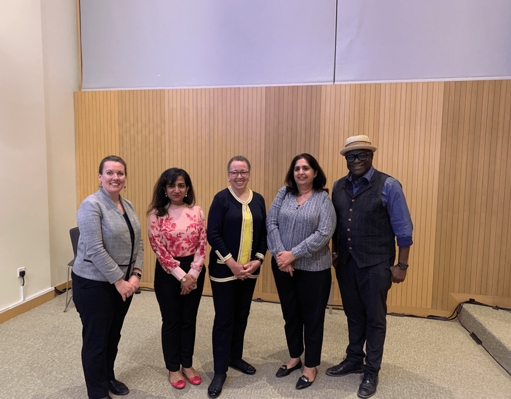 Interim  President Tatum and Trisha Tanner ’00 standing with Sara Pervaiz Amjad ’13, Izmeen Adeel Bajwa ’99 and former MHC professor Awam Amkpa in Abu Dhabi