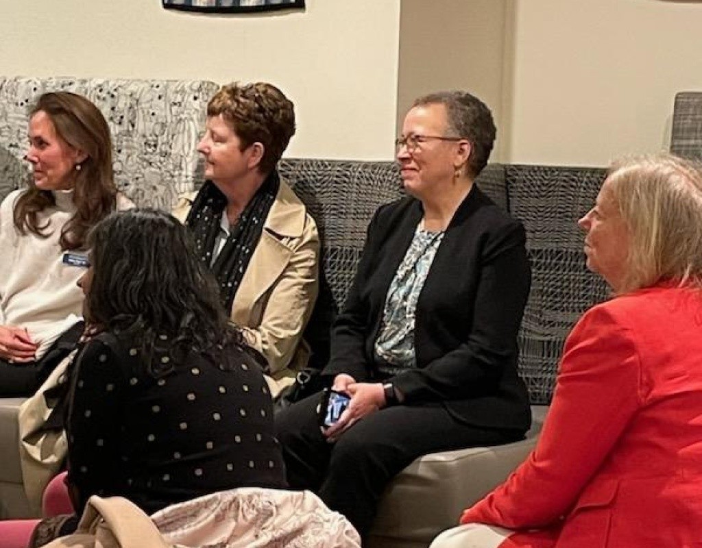 Dr. Beverly Daniel Tatum sitting on the couch before being called to the front of the room.