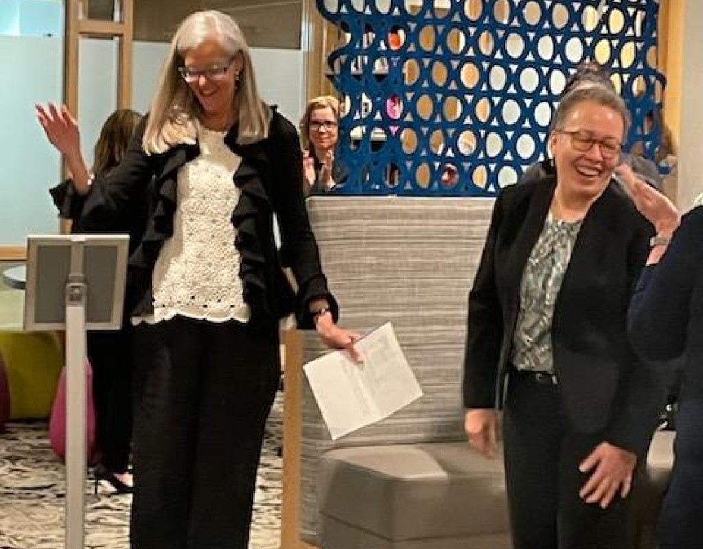 Dr. Beverly Daniel Tatum (right) getting congratulated at the naming event.