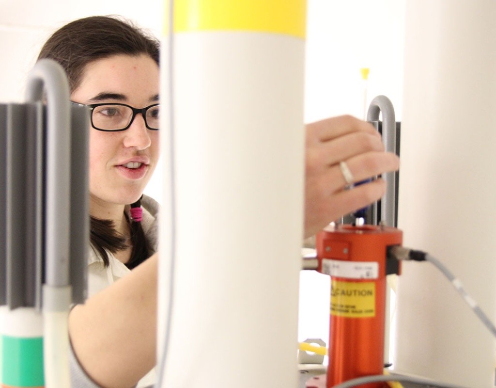 A student using Nuclear Magnetic Resonance (NMR)
