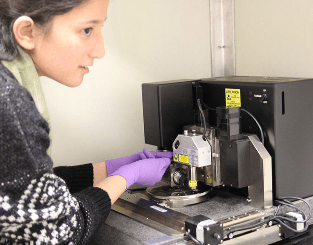 A student using the uv vis atomic force microscope