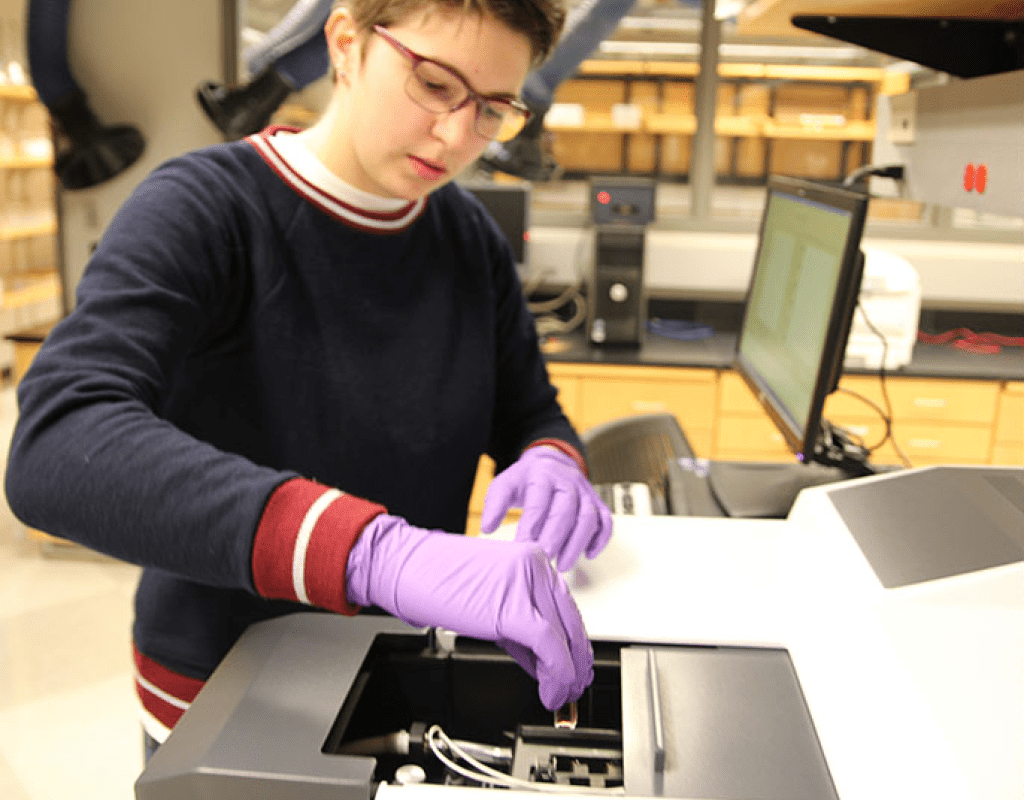 A student using the uv vis atomic force microscope