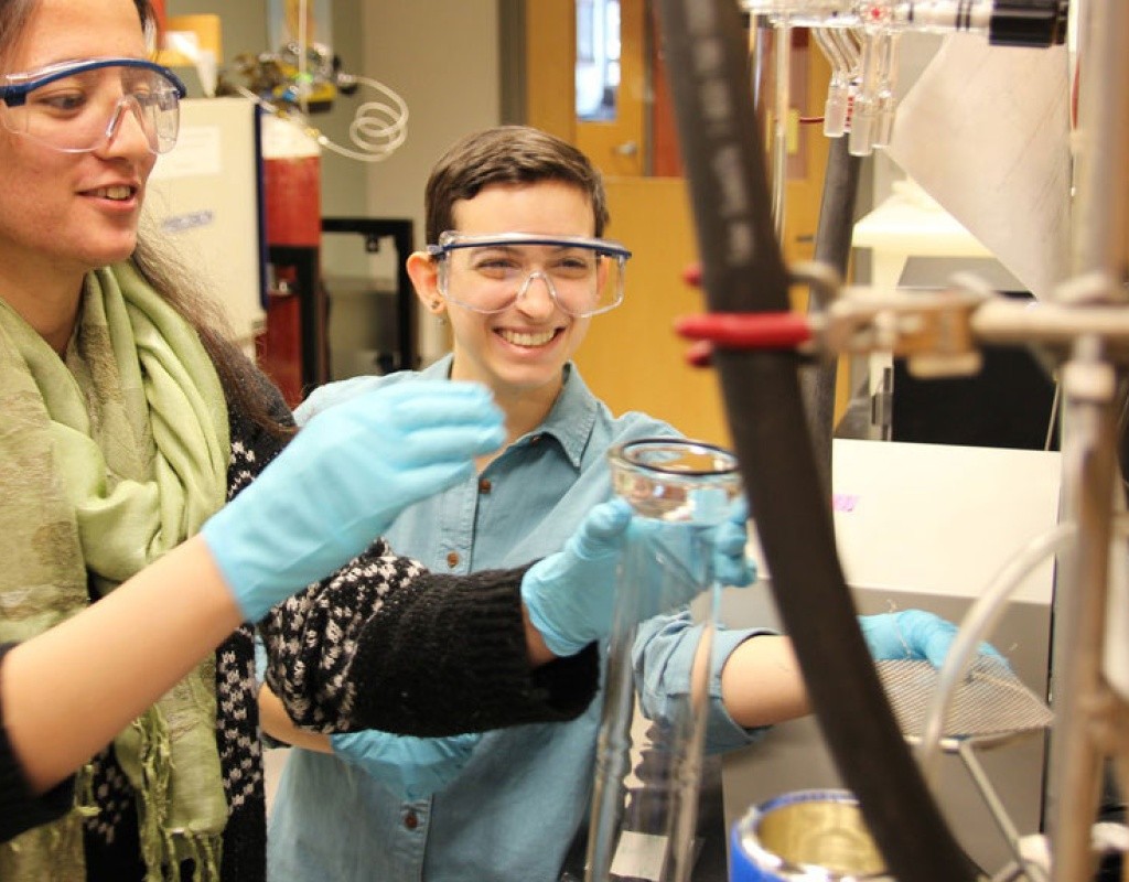 Students using a vacuum apparatus in the chemistry laboratory