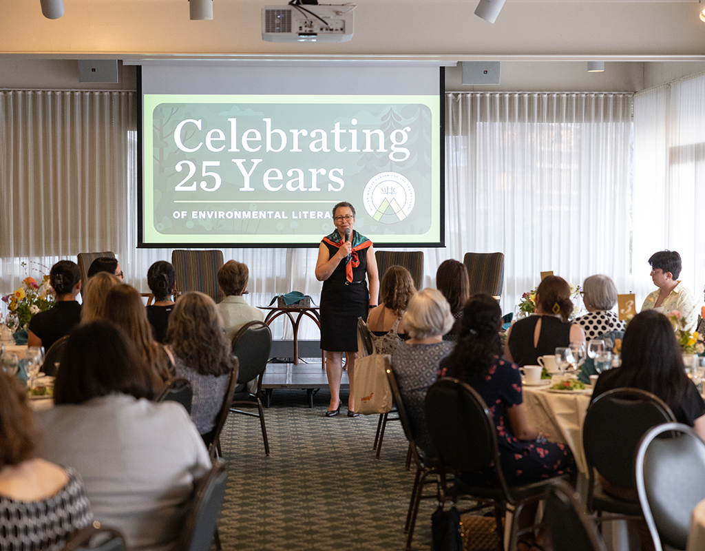 Powerpoint presentation and dinner guests at MWCE Climate Justice Summit.
