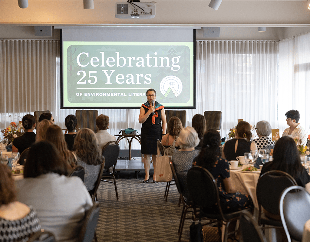 Powerpoint presentation and dinner guests at MWCE Climate Justice Summit.