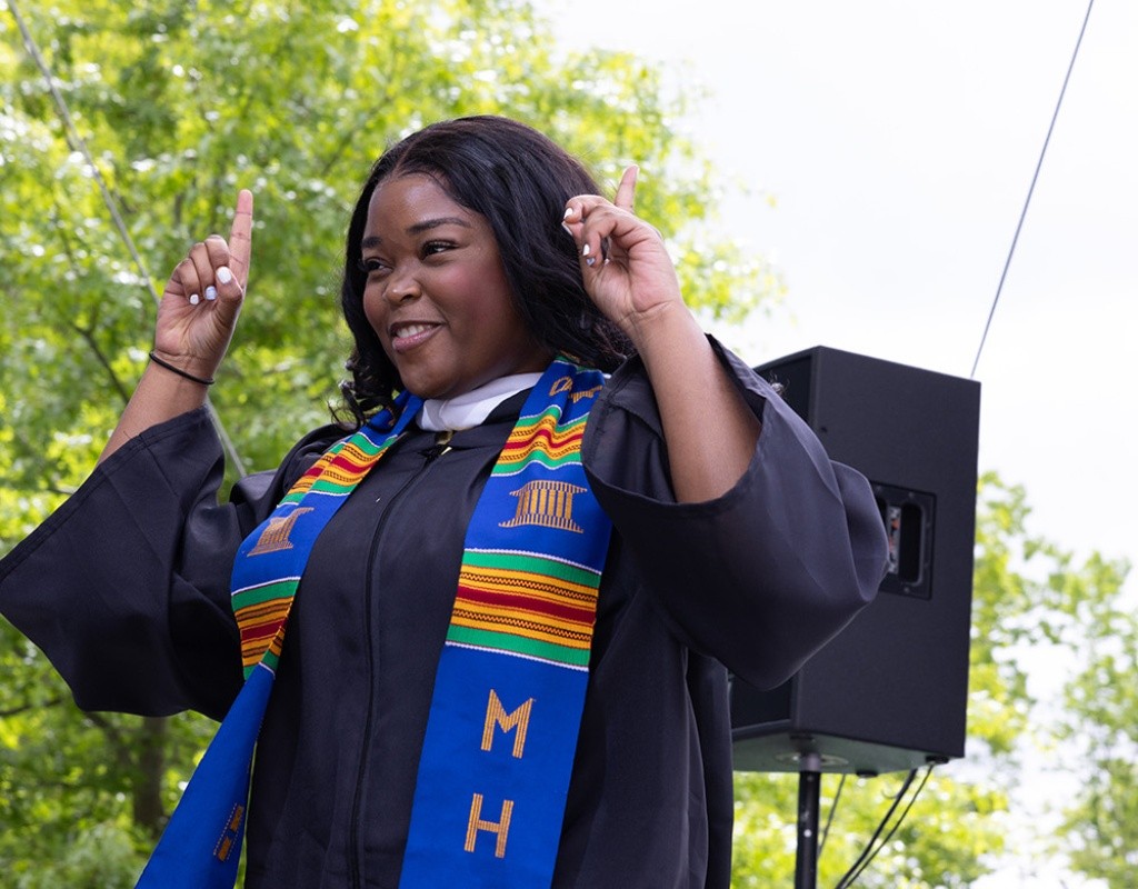 Mount Holyoke Commencement 2024 - Student in robes celebrates