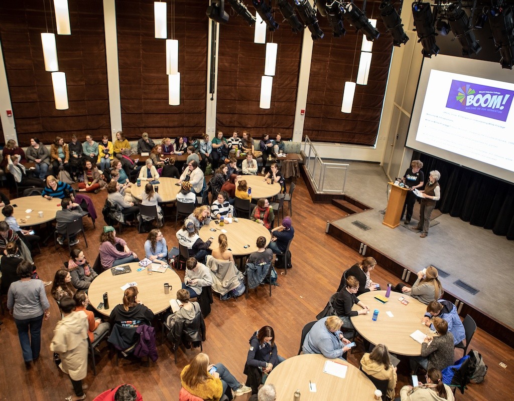 Students, faculty and staff engaged together at the BOOM Learning Symposium
