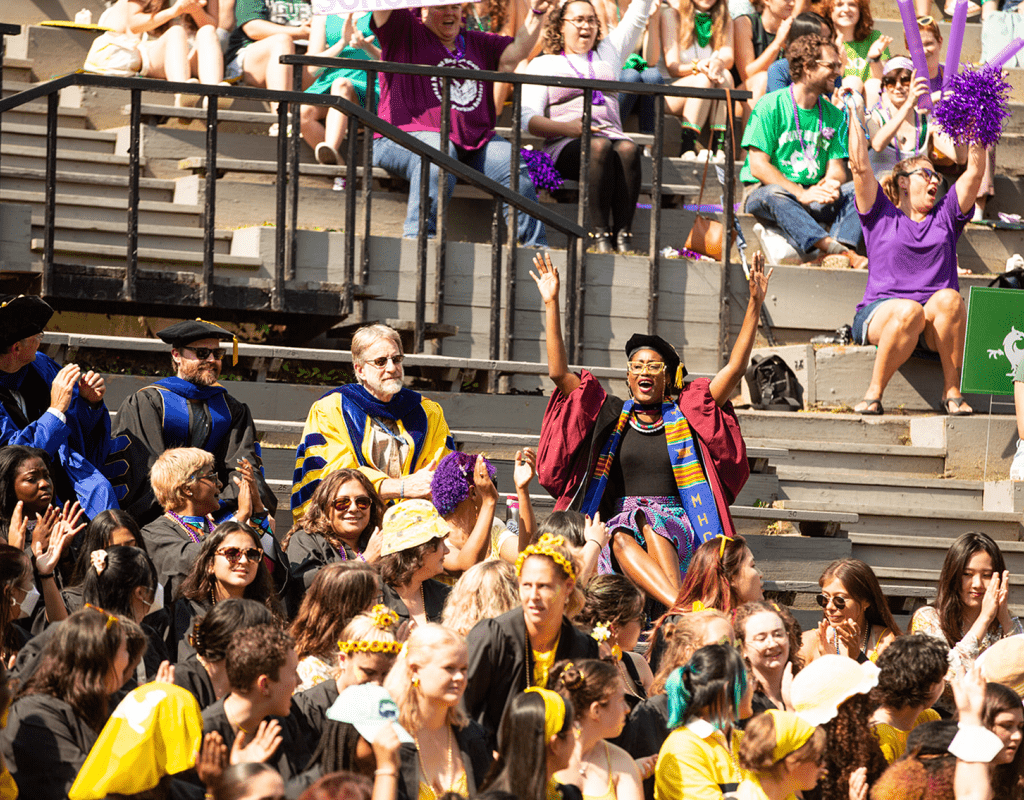 Members of the faculty chering during Convocation 2022