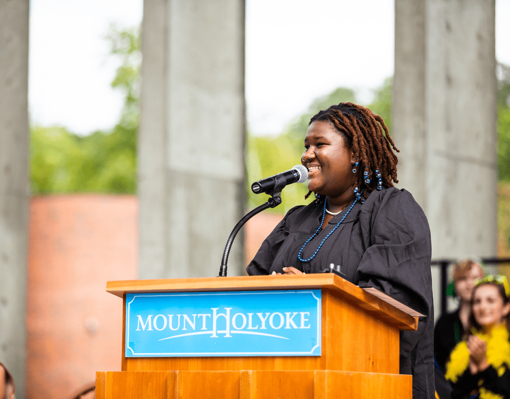 Maille Romulus ’24, Student Government Association president, addresses students at Convocation 2022