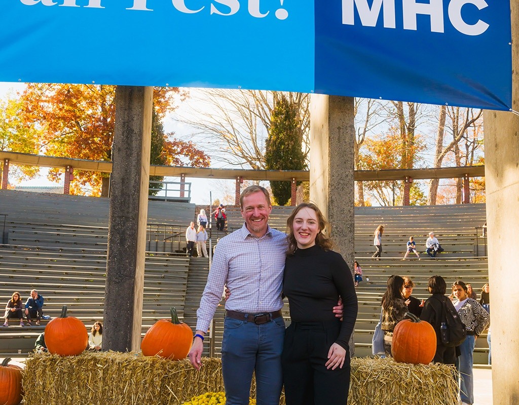 Student with a family member at Mount Holyoke's Fall Fest in 2024