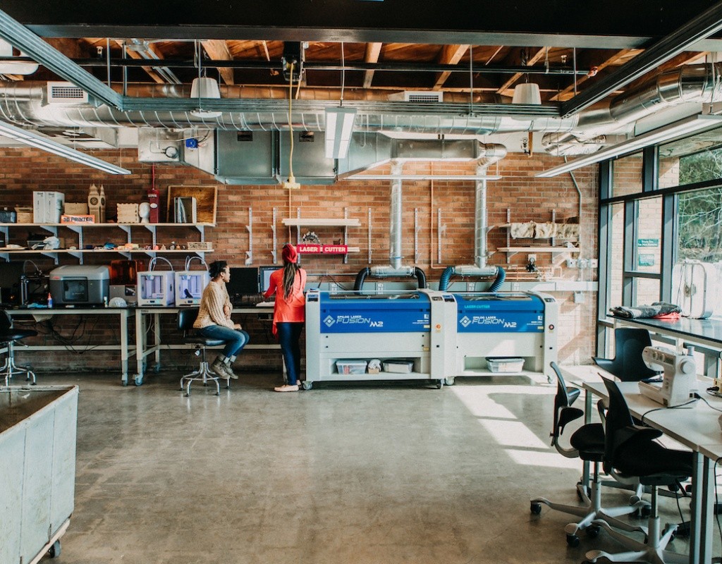 Students sitting near the laser cutters in the Fimbel Lab