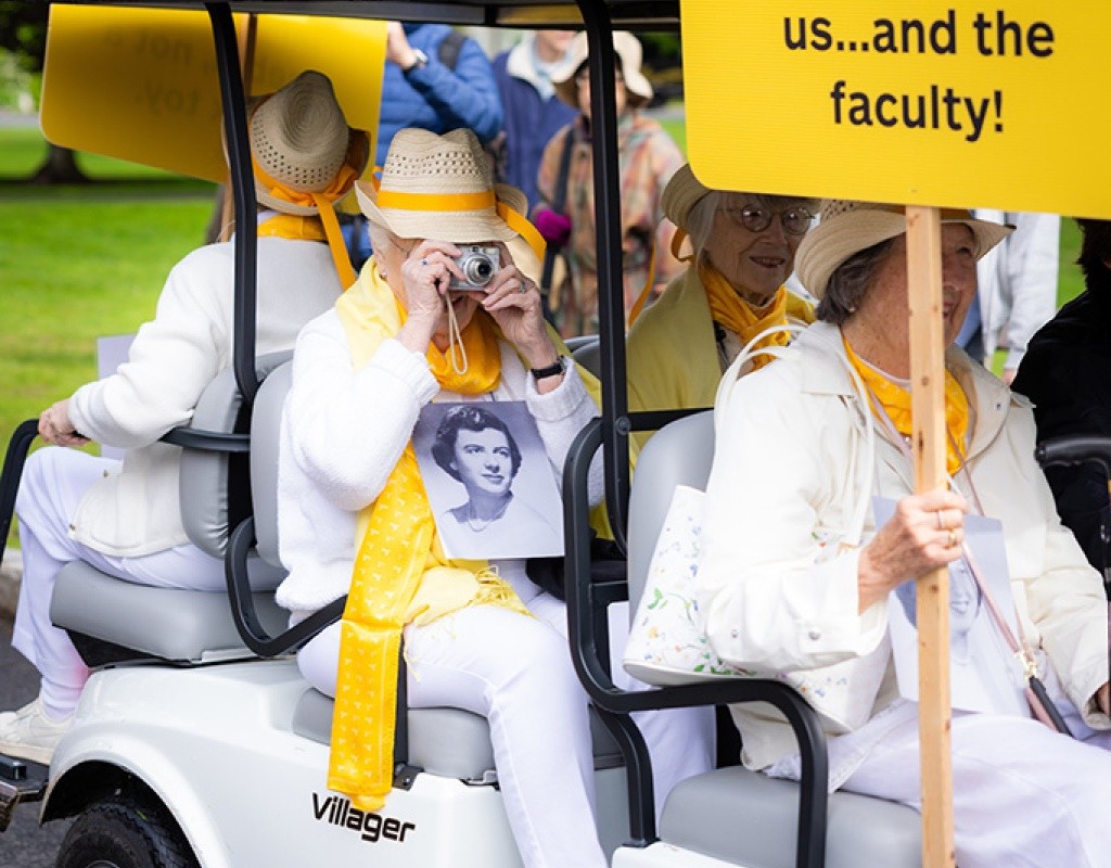 Laurel Parade - yellow class in the golf carts hold a sign as they participate