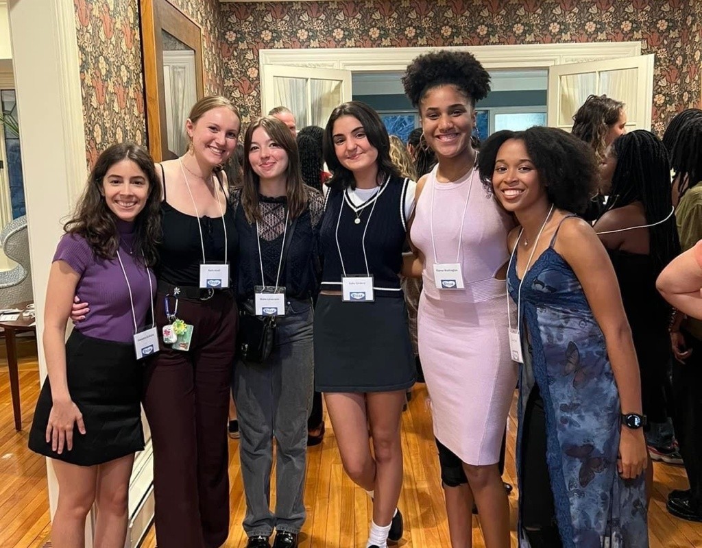 Smiling posse scholars pose together at the President's House, Mount Holyoke.