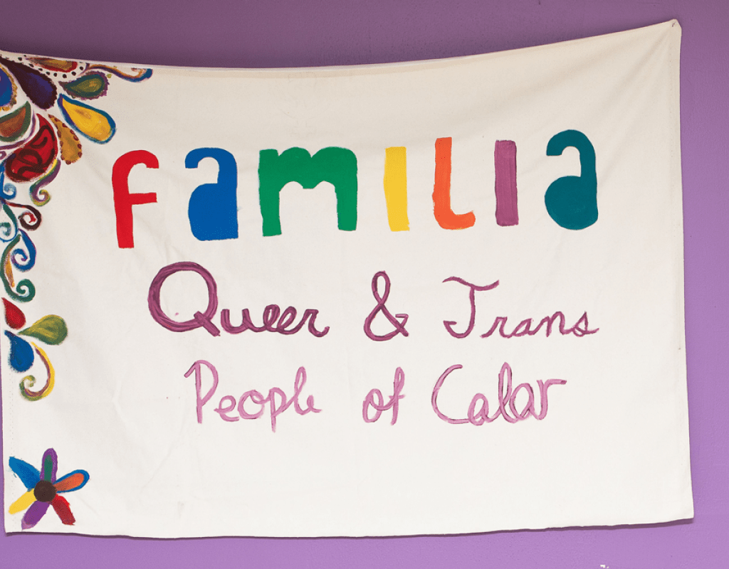A poster that says &quot;Familia: Queer &amp; Trans People of Color&quot;