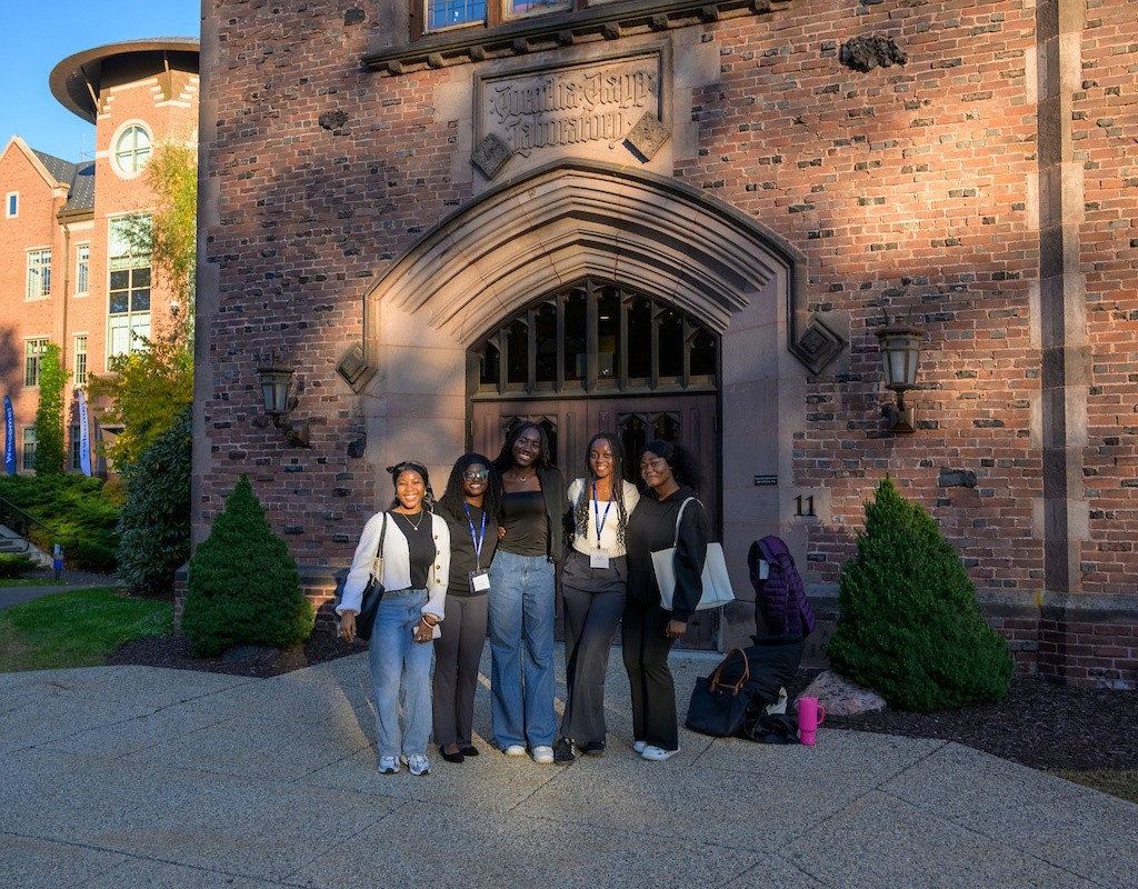 Leap Symposium 2025 - A group of students stand outside.