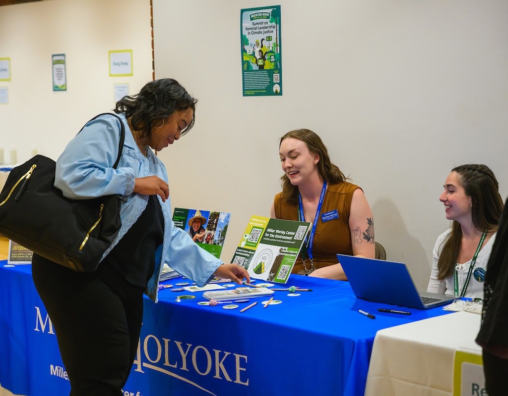 President Holley stops by the information booth at the Summit on Feminist Leadership in Climate Justice held at Mount Holyoke College on April 25, 2025.