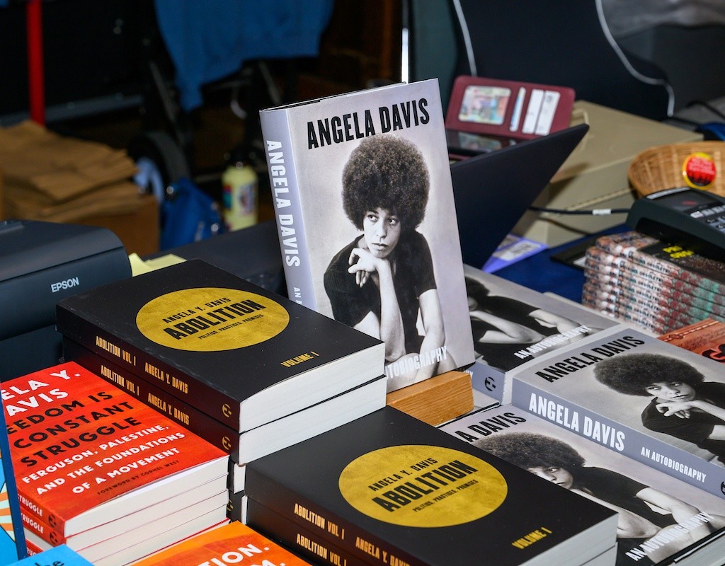Angela Davis books on a table at BOOM! 2025