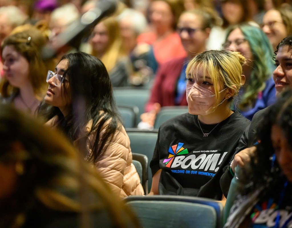 The crowd at BOOM! 2025, including a student wearing a BOOM! 2025 t-shirt.