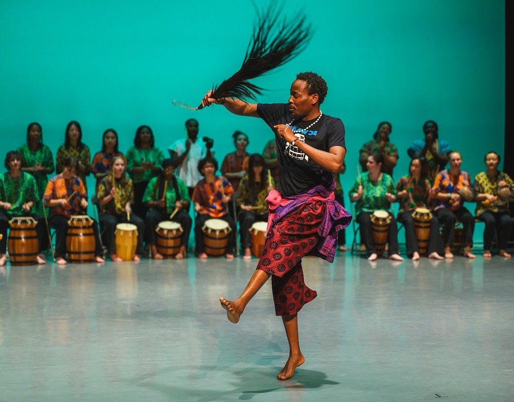 Dance on stage during the AGOO! concert — a night of West African music and dance.