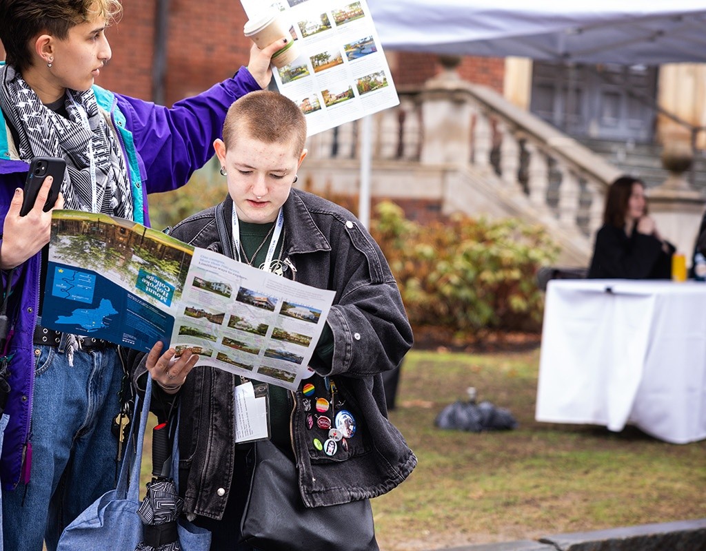 Experience MHC! participants consult the map. April 5, 2025, photo by Jo Chattman.