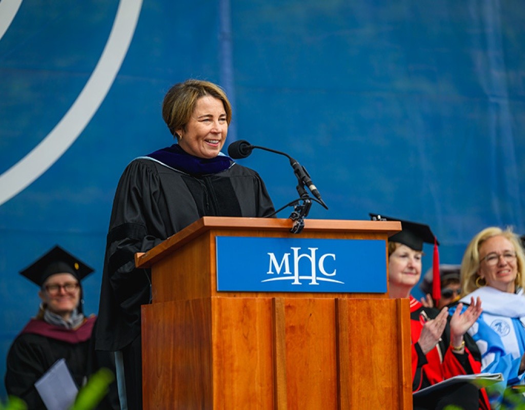 Governor Maura Healey speaking at the podium during Mount Holyoke’s Commencement Ceremony