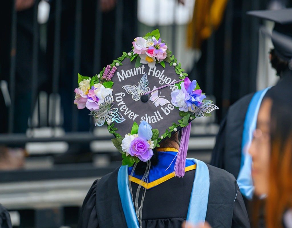 Mount Holyoke student decorated their mortarboard with the words Mount Holyoke Forever Shall Be and flowers
