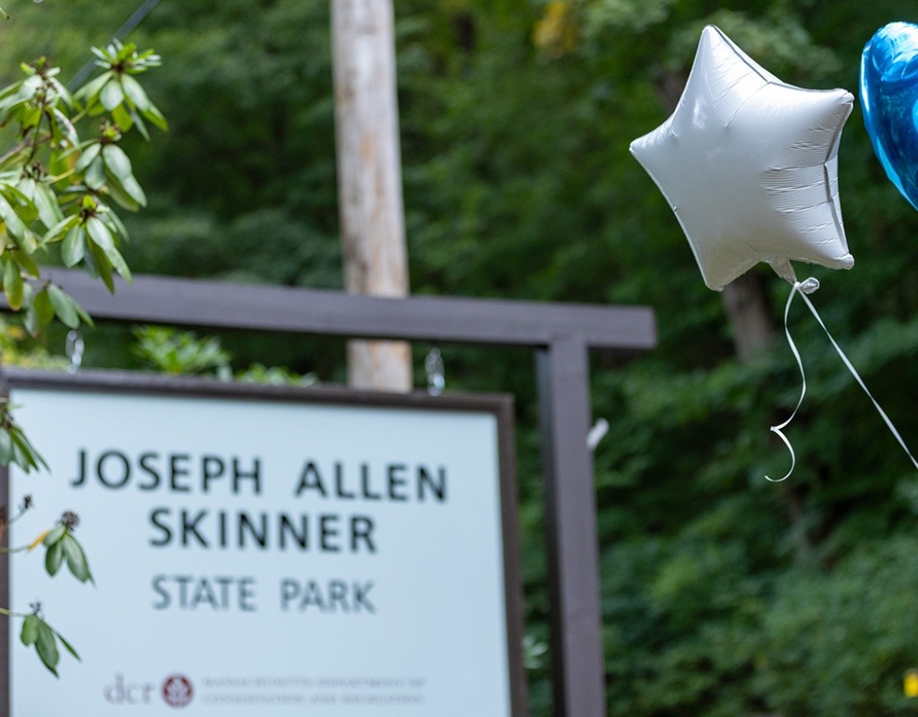 Joseph Allen Skinner State Park sign with blue star and white heart shaped balloons