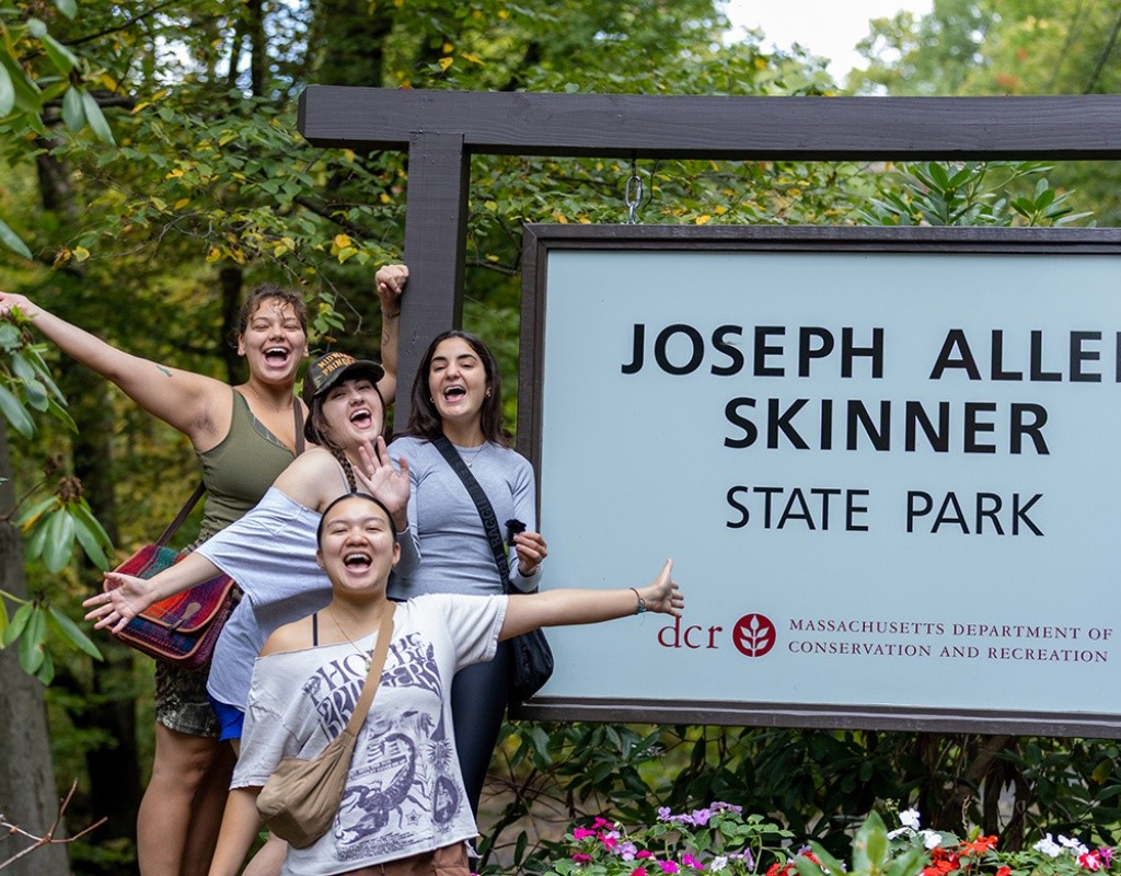 Mount Holyoke students pose in front of the Joseph Allen Skinner State Park sign