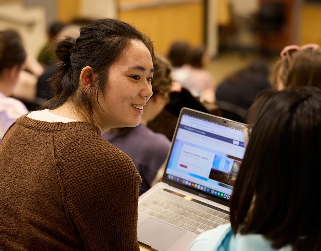 Mount Holyoke College | Senior Symposium 2024 - Audience members discussing the research presented