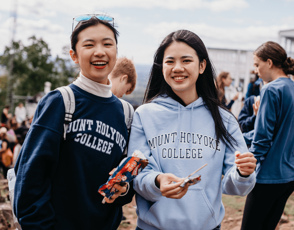 Students enjoying ice cream treats at the summit of Mount Holyoke on Mountain Day 2022