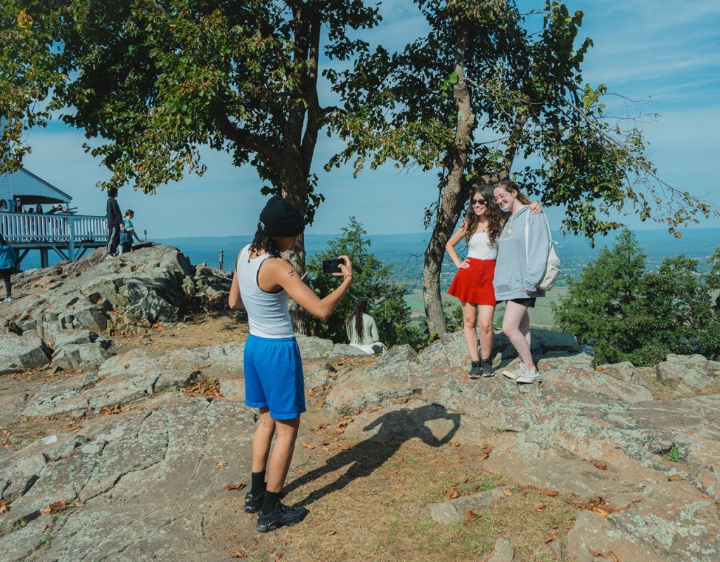 Mountain Day 2024 - Students pose at the top of the mountain for a photo.