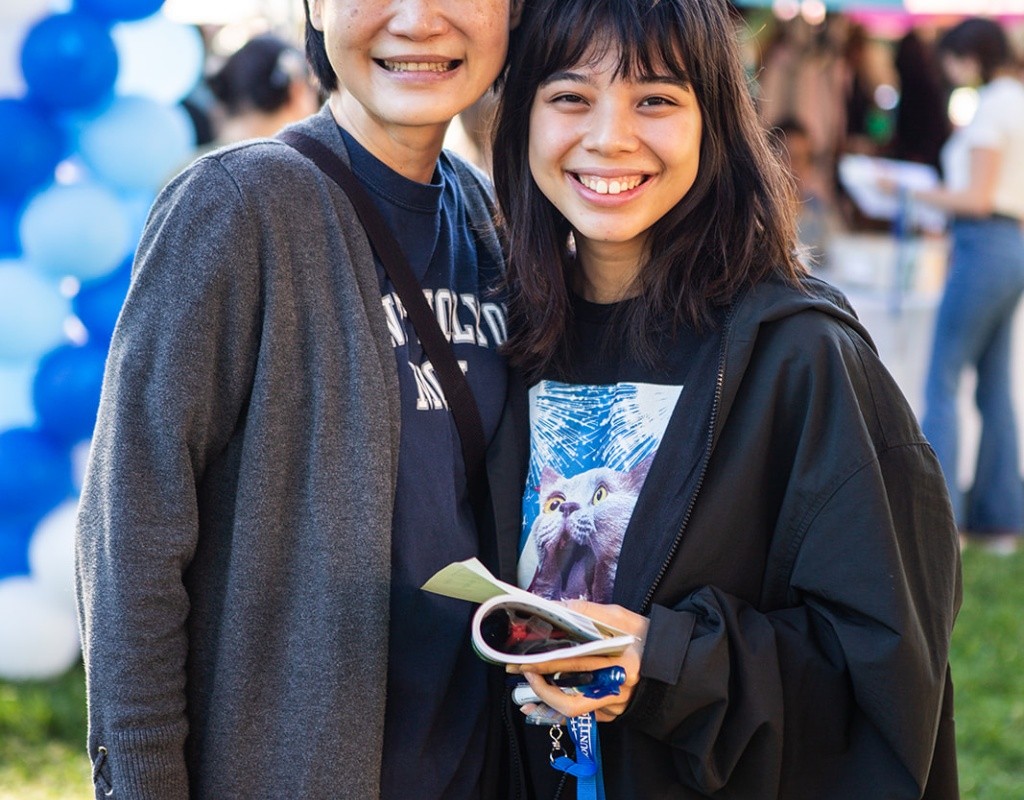 A parent and student hugging on move-in day, 2022