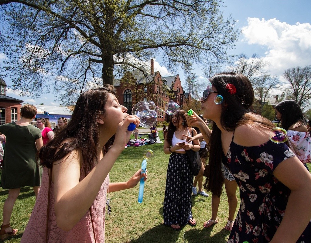 Students blowing bubbles on Pangy Day