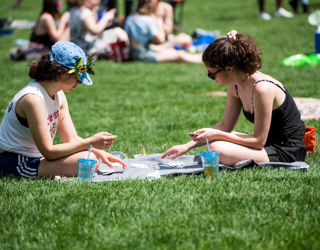 Students playing cards on Skinner Green during Pangy Day