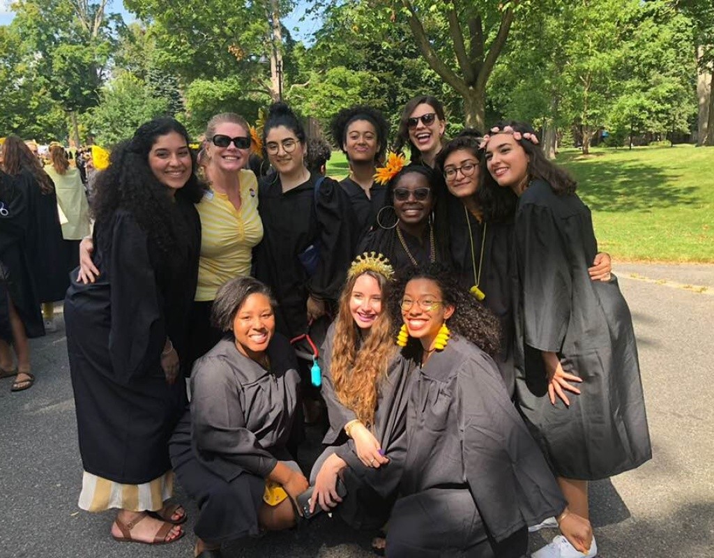 Smiling Posse graduates pose together in regalia.