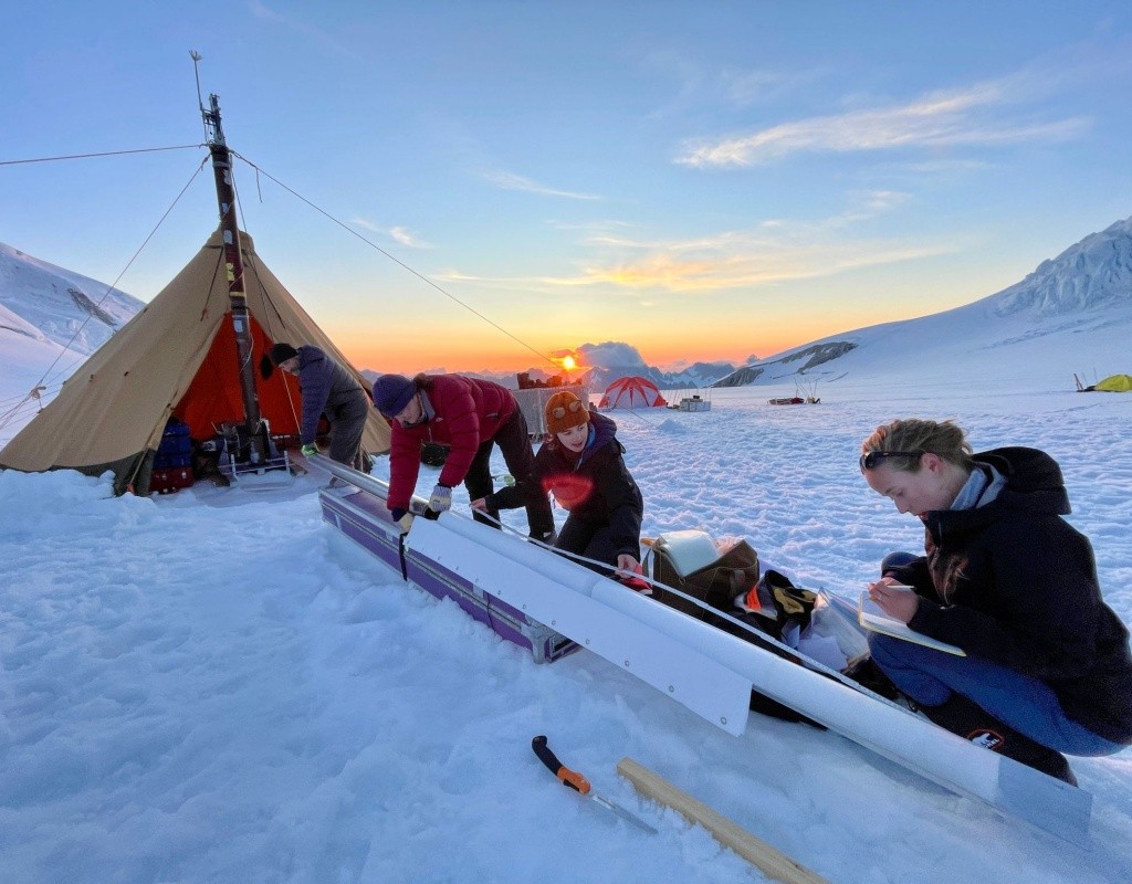 Bridget Hall ’24 and team processing a core from the glacier.