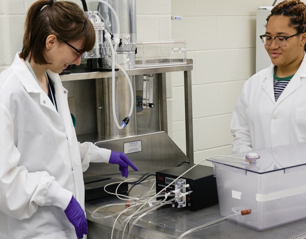Psychology students using lab equipment