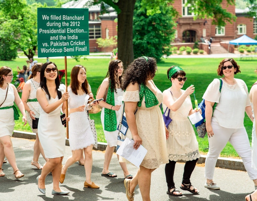 Members of a green pegasus class marching in the Laurel Parade, one of whom is carrying a sign that says &quot;We filled Blanchard during the 2012 Presidential Election&quot;