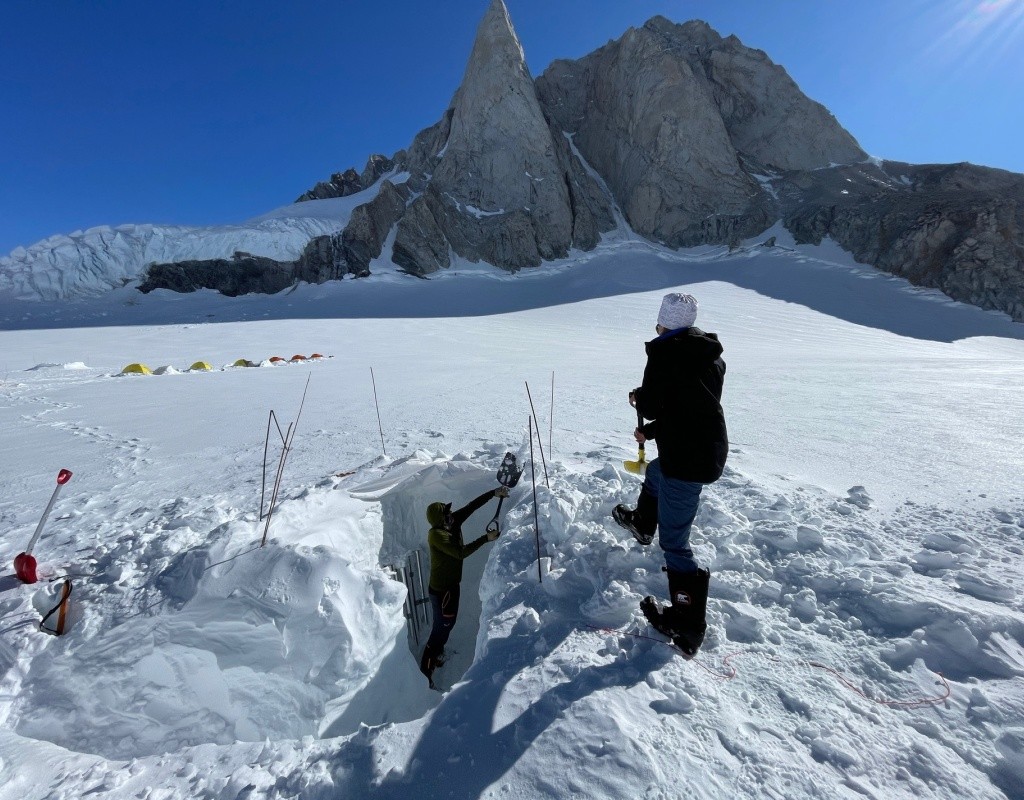 Bridget Hall ’24 shoveling out a snow pit on the glacier.