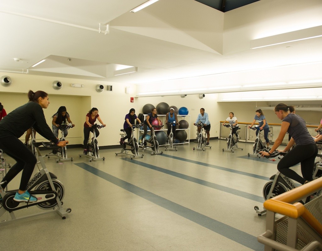Students riding stationary bikes