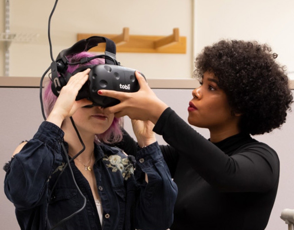 Students using eye tracking equipment